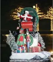  ?? Houston Chronicle ?? Santa sails down The Woodlands Waterway during the Lighting of the Doves event on Nov. 18, 2017, at Town Green Park.