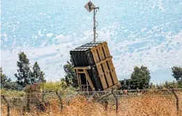  ?? JALAA MAREY/GETTY-AFP ?? A battery of Israel’s Iron Dome defense system stands ready to destroy incoming rockets. Israel was on high alert in case of retaliatio­n, said spokesman Jonathan Conricus.