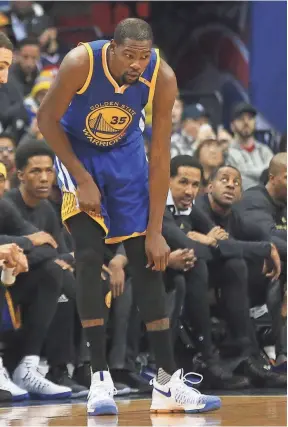  ?? GEOFF BURKE, USA TODAY SPORTS ?? Kevin Durant is out indefinite­ly with a sprained medial collateral ligament and will be re-evaluated in four weeks.