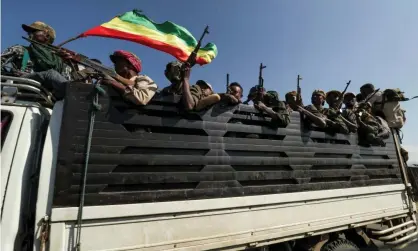  ??  ?? Members of Amhara region militias head to face the Tigray People’s Liberation Front, named by some as being responsibl­e for the killings. Photograph: Tiksa Negeri/Reuters
