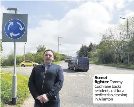  ??  ?? Street fighter Tommy Cochrane backs residents call for a pedestrian crossing in Allanton