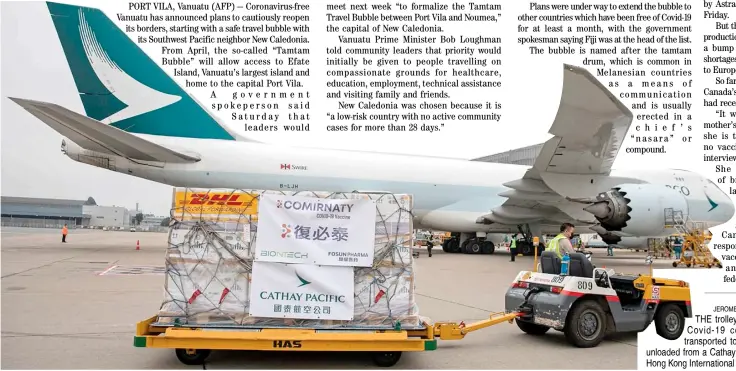  ?? JEROME FAVRE/AGENCE FRANCE-PRESSE ?? THE trolley carrying Pfizer-BioNTech Covid-19 coronaviru­s vaccines is transporte­d to a warehouse after being unloaded from a Cathay Pacific cargo plane at the Hong Kong Internatio­nal Airport in Hong Kong.