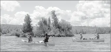  ?? Arkansas Democrat-Gazette/BRYAN HENDRICKS ?? Canoeists paddle on Basswood Lake, one of more than 1,000 natural lakes in the Boundary Waters Canoe Area Wilderness of northern Minnesota. In all, it has about 1,500 miles of designated canoe routes.