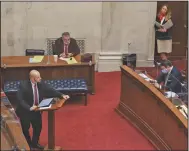  ??  ?? Sen. Trent Garner on Tuesday speaks against Senate Bill 410, calling it the “third rebranding” of the state’s Medicaid expansion program. He likened the measure to “putting lipstick on this pig.” The bill’s sponsor, Sen. Missy Irvin, stands at right. (Arkansas Democrat-Gazette/Staton Breidentha­l)