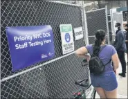  ?? ASSOCIATED PRESS ?? People stand in line outside a COVID-19testing site in Brooklyn on Wednesday, Oct. 7, 2020.