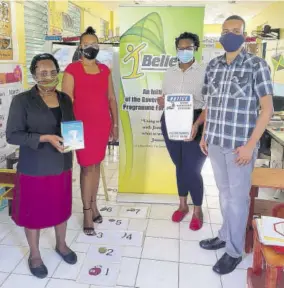  ??  ?? IBI Ambassador­s Natasha Burnett (second left) and Dr Romario Simpson with Ms Williams, principal of St Barnabas Early Childhood Centre, and Toni-moy Stewart from the Rotary Club.