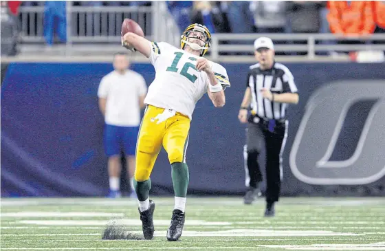  ??  ?? Packers quarterbac­k Aaron Rodgers throws a Hail Mary during the fourth quarter.