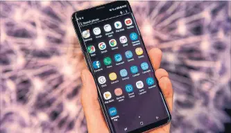  ?? CHRIS J. RATCLIFFE/BLOOMBERG ?? Fewer buyers than expected shelled out for Samsung’s new device, the Galaxy S9. Top-end versions approach the $1,000 mark.