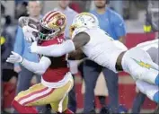  ?? Godofredo A. Vásquez Associated Press ?? CHARGERS LINEBACKER Kenneth Murray Jr. tries to grab hold of 49ers receiver Deebo Samuel.