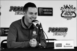  ?? ASSOCIATED PRESS ?? ALEX BOWMAN ANSWERS QUESTIONS during a media availabili­ty Friday before a practice session for Sunday’s NASCAR Cup Series Pocono 400 auto race in Long Pond, Pa.