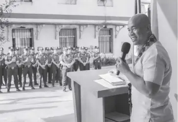  ?? ?? Atty. Jerome Asuga, director of the National Police Commission Region 6, is the guest of honor and speaker during the Iloilo City Police Office’s (ICPO) flag raising and awarding ceremonies on Monday, March 11.