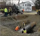  ?? RECORD FILE PHOTO ?? Crews work to repair a water line that ruptured Jan. 17, 2016, in the Lansingbur­gh section of Troy.