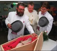  ??  ?? Punxsutawn­ey Phil awaits his necropsy earlier this week attended by an honor guard of the Inner Circle of the Groundhog Club. It turns out his death was all a ruse.