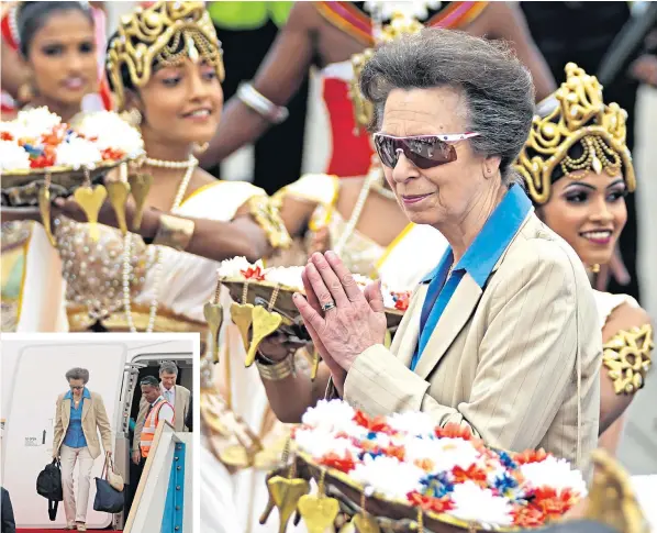  ?? ?? The Princess Royal enjoys a display of traditiona­l Sri Lankan dancing yesterday after her low-key, no nonsense arrival at Colombo Internatio­nal airport, inset left, on the first royal tour of 2024