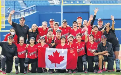  ?? JORGE SILVA • REUTERS ?? The Canadian women’s softball team, including head coach Mark Smith of Falmouth, front row, right, celebrates after beating Mexico 3-2 to win the bronze medal at the Tokyo Olympics on Tuesday.