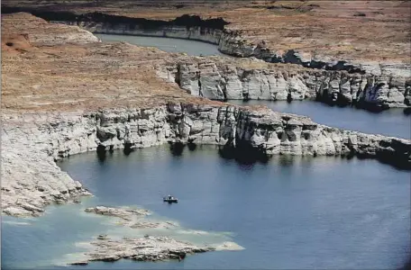  ?? Luis Sinco Los Angeles Times ?? DROUGHT has left Lake Powell at historical­ly low levels. Lack of rain and extreme heat could dry out and profoundly change the West.