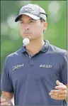  ?? AP PHOTO ?? Kevin Kisner tosses a ball before his tee shot on the 18th hole during the Dean & DeLuca Invitation­al golf tournament at Colonial Country Club in Fort Worth, Texas, Sunday.