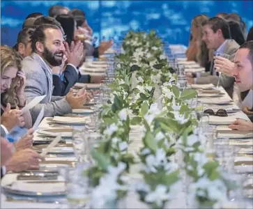  ?? Brian van der Brug Los Angeles Times ?? TWO DOZEN of L.A.’s top real estate agents attend a dinner party to unveil a luxury penthouse at 8899 Beverly. “Who wants that $1.5-million commission?” a listing agent said at the start of the five-course meal.