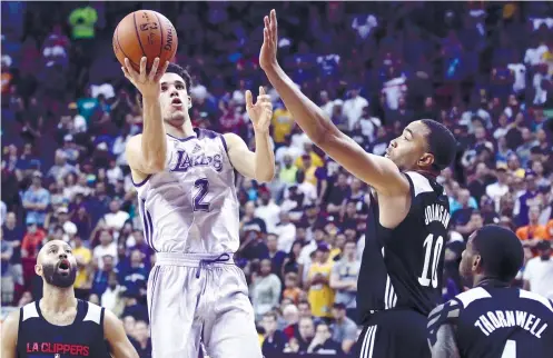  ?? AP FOTO ?? OWNING VEGAS. Lonzo Ball (center) was named Vegas MVP of the NBA Summer League despte sitting out much of the finals with a calf injury. Ball is the No. 2 pick pf the LA Lakers.