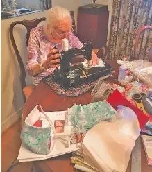  ?? PHOTO FROM LYNN HOWARD ?? Emily Howard sews a face mask as part of a service project of the Master Gardeners of Hamilton County.