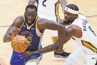  ??  ?? Warriors forward Draymond Green racked up 10 points, 15 assists and 13 rebounds. The Warriors moved four games ahead of 11thplace New Orleans with seven games remaining.