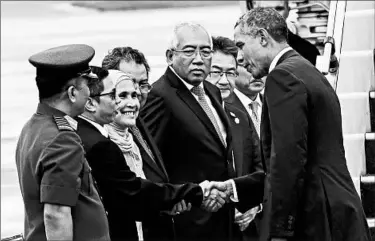  ?? AHMAD YUSNI/EPA ?? President Barack Obama exchanges greetings with Malaysian officials Sunday before his return to the United States.