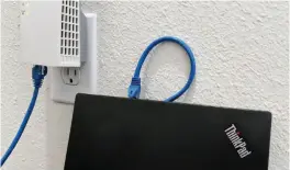  ??  ?? Connecting a laptop to the Wi-fi extender.