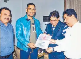  ?? HT ?? MS Dhoni signed a deal at Ranchi for the opening of his cricket academy in Lucknow.