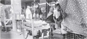  ?? ?? Ambulant vendors trading on the streets of Bacolod City were reminded to observe the allowed spaces and schedules based on a local ordinance. Photo shows a line of makeshift stalls in the city’s downtown area taken yesterday morning.