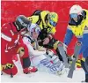  ?? PHOTO: GETTY IMAGES ?? Lindsey Vonn is helped by officials after crashing during the Super G at the World Championsh­ips in Are, Sweden, yesterday.