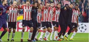  ?? EPA PIC ?? PSV players celebratin­g after their victory over BATE Barisov.