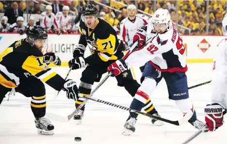  ?? GREGORY SHAMUS/GETTY IMAGES ?? Washington Capitals centre Evgeny Kuznetsov takes a shot during Game 3 against the Penguins on Monday in Pittsburgh. The Caps outshot the Penguins 33-30 in that game and won, then outshot them 38-19 in Wednesday’s loss.
