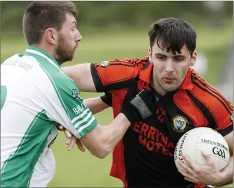  ??  ?? Ballyduff’s Thomas Slattery keeping a close grip on Mike Connor, Sneem/Derrynane