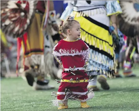  ?? PHOTOS: GREG SOUTHAM ?? Even the youngest members are encouraged to take part as dancers express themselves during the traditiona­l powwow dancing and drum circles at K-Days.