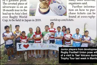  ?? PHOTO COURTESY OF JEOFFREY MAITEM ?? Junior players from developmen­t clubs and foundation­s of the Philippine Rugby Football Union pose with the Webb Ellis Cup (also inset) as part of a visit to Taal Volcano during day one of the Rugby World Cup 2019 Trophy Tour last week in Manila.