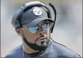  ?? Ap phOTO ?? Pittsburgh Steelers head coach Mike Tomlin stands on the sideline during the first half of an NFL football game against the Minnesota Vikings in Pittsburgh, Sunday.