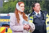  ?? LUKE MACGREGOR / REUTERS ?? An injured woman is led away after an attack in London on Friday.