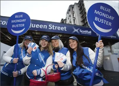  ??  ?? Buchanan Galleries promo staff Leeann Mackay, Nicki Macdonald, Tyler McNeill and Lara Fabiani were at Queen Street Station this morning to turn Glasgow commuters’ frowns upside down with their Blue Monday voucher giveaway