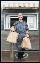  ??  ?? BAGS OF HELP Fiona Crump, who owns Castle Beach Cafe in Falmouth