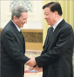  ?? FENG YONGBIN / CHINA DAILY ?? Liu Yunshan, a member of the Standing Committee of the Political Bureau of the CPC Central Committee, meets Ramon Balaguer, head of the Internatio­nal Department of the Communist Party of Cuba at the Great Hall of the People in Beijing on Wednesday.