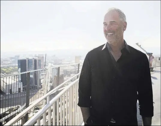  ?? Elizabeth Brumley Las Vegas Review-Journal @EliPagePho­to ?? Golden Entertainm­ent Chairman and CEO Blake Sartini on Tuesday on top of the Stratosphe­re, which Golden acquired.