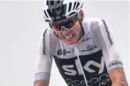  ??  ?? Great Britain’s Christophe­r Froome crosses the finish line Wednesday in eighth place during the 17th stage of the Tour de France. He dropped to third place overall.