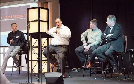  ?? Arkansas Democrat-Gazette/FRANCISCA JONES ?? Travis Story (second from left) of Story Law Firm in Fayettevil­le speaks during a question-and-answer panel at the church security preparatio­n seminar hosted by the Arkansas Baptist Convention at Park Hill Baptist Church in North Little Rock on Monday....