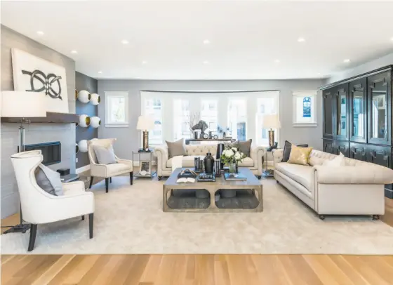  ?? Olga Soboleva / Vanguard Properties ?? The spacious living room at 231 24th Ave. features a Valor fireplace and five-inch rift and quarter-sawn white oak floors.