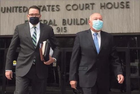  ?? Ned Gerard / Hearst Connecticu­t Media ?? Former Bridgeport Police Chief Armando Perez, right, leaves the federal courthouse in Bridgeport on Oct. 5, alongside his attorney, Robert Frost.