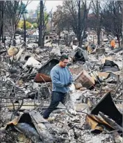  ?? Luis Sinco Los Angeles Times ?? OFFICIALS MUST look at repeated events to create a better fire management plan, experts suggest. Above, Coffey Park residents sift through rubble.