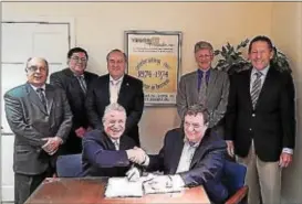  ?? SUBMITTED PHOTO ?? Cirilli Associates Inc. of Springfiel­d, Delaware County, recently acquired Yerkes Associates Inc. of West Chester. Shown, sitting from left, are: Nick Cirilli and John B. Yerkes Jr. Standing from left are: Harry Diakatos of GPCD Partners; Louis M....