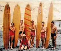  ??  ?? Tony Johnson, second from right, and friends at Taylors Mistake beach in the early 1960s with his own hollow plywood Dolphin label surfboards. Denis Quane, front, would watch ‘‘Tone’’ make boards, and went on to make his own.