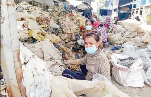  ?? SUPPLIED ?? Women workers recycle plastic at the company’s depot in Prek Kampoes commune in Phnom Penh’s Dangkor district.