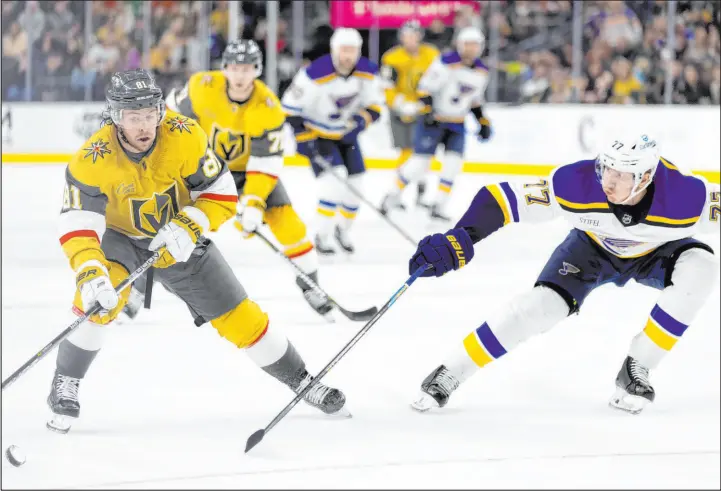  ?? Ellen Schmidt
The Associated Press ?? Golden Knights center Jonathan Marchessau­lt looks to shoot on goal as St. Louis Blues defenseman Niko Mikkola stretches for the block Saturday night at T-mobile Arena.